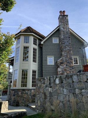 This Beautiful Lake House - We worked on this beautiful lake house on a charming island for almost two months. There were many carpentry repairs, and we replaced some rotten wood with synthetic.
Cedar shakes had seriously peeling paint that we had to remove. Then, we primed the entire house (shakes and trim) with an oil-based primer. We used two coats of Sherwin - Williams "Woodscapes" for the shingles and two coats of Sherwin - Williams "Emerald" for the trim. We also refinished natural, stained doors and a fence.
Even though we matched the color so that the "Before" and "After" pictures look similar, you can see a significant difference. This Beautiful Lake House - We worked on this beautiful lake house on a charming island for almost two months. There were many carpentry repairs, and we replaced some rotten wood with synthetic.
Cedar shakes had seriously peeling paint that we had to remove. Then, we primed the entire house (shakes and trim) with an oil-based primer. We used two coats of Sherwin - Williams "Woodscapes" for the shingles and two coats of Sherwin - Williams "Emerald" for the trim. We also refinished natural, stained doors and a fence.
Even though we matched the color so that the "Before" and "After" pictures look similar, you can see a significant difference.