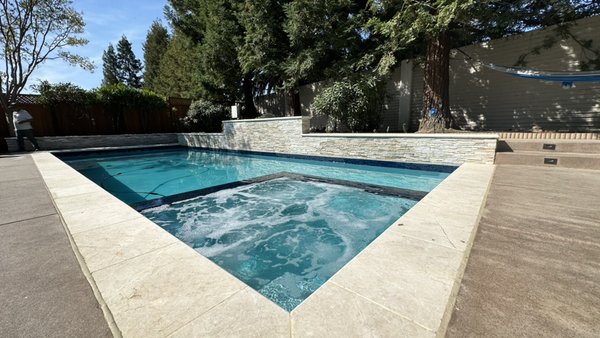 Pool Construction - This was a new pool construction with built in spa and safety pool cover in Fremont, CA. A raised water feature wall with three shear descents, complete concrete decking and yard lighting. Pool Construction - This was a new pool construction with built in spa and safety pool cover in Fremont, CA. A raised water feature wall with three shear descents, complete concrete decking and yard lighting.