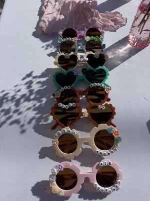 Summer theme party - Kickin off summer with great vibes! The kids had so much with the waterslide, an interactive facial experience, putting charms/beads on sunglasses, and getting a mani/pedi.