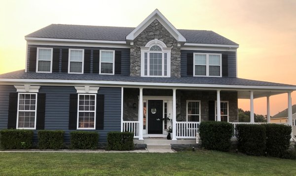 Complete transformation - This customer wanted to upgrade and stand out in his neighborhood. He made the right choice not only in the color siding but in using us to give him a home he can be proud of.
