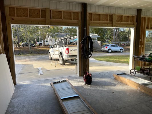 New install - House on stilts in Wilmington, customer wanted to close it in and add garage doors to it. Doors also have up to 130mph windspeed, perfect for the beach area. This project was very fun to do and came out just like the customer wanted! We love making our customers houses look amazing! New install - House on stilts in Wilmington, customer wanted to close it in and add garage doors to it. Doors also have up to 130mph windspeed, perfect for the beach area. This project was very fun to do and came out just like the customer wanted! We love making our customers houses look amazing!
