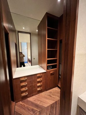 Custom Hardwood Walk-In Closet & Built-In Vanity - Designed and built a luxury custom walk-in closet system using high-end hardwood finishes. This project features integrated floor-to-ceiling wardrobe shelving, hanging rods, full-extension storage drawers, and a custom built-in vanity station with an illuminated mirror. Perfect combination of maximized storage capacity and elegant interior design. Custom Hardwood Walk-In Closet & Built-In Vanity - Designed and built a luxury custom walk-in closet system using high-end hardwood finishes. This project features integrated floor-to-ceiling wardrobe shelving, hanging rods, full-extension storage drawers, and a custom built-in vanity station with an illuminated mirror. Perfect combination of maximized storage capacity and elegant interior design.