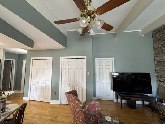 Foyer Repaint - The red in this space was INTENSE. This Acacia Haze lightened the space up nicely and updated the look to be more current with modern trends. Our customer was very pleased with how this came out. We love it too!