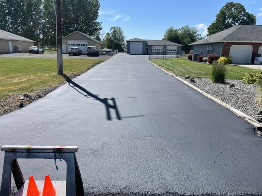 Sealed and protected it from tearing apart - The driveway hasn’t been sealed for over 10 yr I had to give it a real deep clean blowout, all the access dirt out of the cracks and hot tar them after then put a heavy coat of  Seal master Seal to save the asphalt when it’s these type of driveways, you have to pay attention to almost everything cleaning wise before you lay down any sealer. If you leave some kind of access dirt, the material will not stick and stay as long as it intended
But a little hard work does pay off. 
looks great and amazing