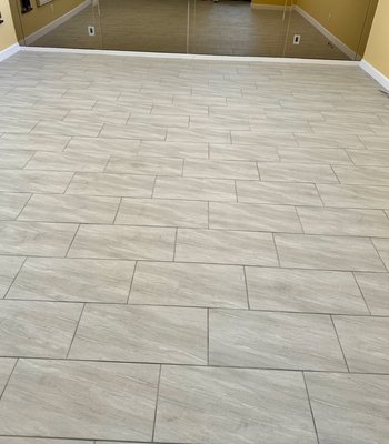 Porcelain Tile Flooring Installation for JJ and Regina H. in Scottsdale, AZ - Project Brief: Porcelain Tile Installation for JJ and Regina H.

Project Title:
Porcelain Tile Flooring Installation for JJ and Regina H. in Scottsdale, AZ

Client:
JJ and Regina H.

Location:
Scottsdale, Arizona

Scope of Work:
Zona Floors was honored to provide and install 5,900 square feet of high-quality porcelain tile flooring for JJ and Regina H.'s beautiful Scottsdale home. This project required precise planning, expert craftsmanship, and attention to detail to deliver a flawless result that matched the client’s vision.

Details:

Flooring Material: Premium porcelain tile, chosen for its durability, timeless aesthetic, and ability to withstand the Arizona climate.
Square Footage: 5,900 sq. ft., covering expansive interior spaces with seamless transitions and cohesive design.
Installation Process: Zona Floors’ professional installation team ensured every tile was expertly placed, aligned, and finished to perfection. Specialized tools and techniques were used to achieve clean lines and uniformity across the entire area.
Challenges and Solutions:

Large Scale: Managing a project of this size required efficient coordination to meet timelines without compromising quality.
Climate Considerations: Porcelain tile was selected for its cooling properties, making it an excellent choice for Arizona’s desert climate.
Outcome:
JJ and Regina H. are thrilled with the transformation of their home. The new porcelain tile floors not only elevate the aesthetic appeal of their living spaces but also provide a practical, long-lasting flooring solution for years to come.

Client Testimonial:
“Zona Floors exceeded our expectations! The porcelain tile floors are stunning, and the craftsmanship is impeccable. The team was professional, efficient, and detail-oriented throughout the entire project.”

About Zona Floors:
Zona Floors is a premier flooring contractor in Arizona, specializing in residential projects, including tile, vinyl, and luxury flooring installations. With a commitment to quality and customer satisfaction, Zona Floors delivers exceptional results for homes across Scottsdale, Tempe, and beyond.