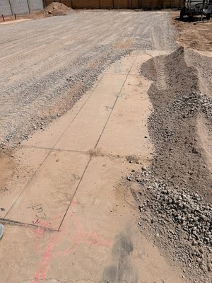 Concrete saw cut and demo - This Concrete slab Demo took place for a new peddle stool for a new arrival in a mobile home park we marked up measurement points , threw down our lines  , we saw cut the slab before removing all debris picked up and hauled off