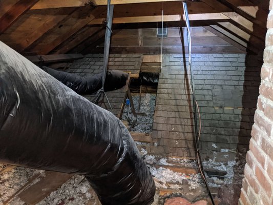 Insulation Upgrade - After air sealing a few major gaps in the attic floor of this 60 year old home, we added blown-in fiberglass insulation to bring the attic to R-49.