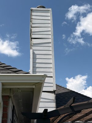 Chimney being stripped - When your neighbors start handing out your phone number for you, you're doing something right. This Caddo Mills project came to us as a referral from a previous customer — and turned into one of our favorite transformations of the summer.
THE PROBLEM
The siding on the chimney chase was failing. Chimney chases are one of the most exposed and most ignored spots on a house — they take weather from all four sides, sit high where nobody looks, and once the siding starts to go, water has a direct path toward the home. Left alone, a cosmetic problem becomes a structural one.
WHAT WE DID
— Stripped the damaged siding from the chimney chase and rebuilt it with new siding, caulked and sealed tight
— Followed with a complete exterior repaint: full wash and prep first, then two finish coats in a crisp white scheme across roughly 247 linear feet of home perimeter
— Ran both scopes back-to-back with one crew, so the rebuilt chimney was painted to match the home — the repair doesn't just hold up, it disappears
— Clean site every day, full haul-off at the end
WHY THE HOMEOWNER BUNDLED
Pairing the chimney rebuild with the repaint meant one mobilization, one timeline, and package pricing — and a finished product that reads as one seamless job, because it was. If your chimney chase needs work and your paint is tired anyway, doing them together is the smart money.
THE RESULT
A bright, clean, like-new exterior — and a chimney that went from the worst thing on the house to invisible in the best way.
This is what we mean by a white collar experience in a blue collar industry: clear scope, written proposal, tidy jobsite, and work we're proud to put our name on. Roofing, siding, painting, fences, seamless gutters, and full exterior services.
Serving Caddo Mills, Greenville, and all of DFW.
The White Collar Roofer | 972-837-6900 | thewhitecollarroofer.com Chimney being stripped - When your neighbors start handing out your phone number for you, you're doing something right. This Caddo Mills project came to us as a referral from a previous customer — and turned into one of our favorite transformations of the summer.
THE PROBLEM
The siding on the chimney chase was failing. Chimney chases are one of the most exposed and most ignored spots on a house — they take weather from all four sides, sit high where nobody looks, and once the siding starts to go, water has a direct path toward the home. Left alone, a cosmetic problem becomes a structural one.
WHAT WE DID
— Stripped the damaged siding from the chimney chase and rebuilt it with new siding, caulked and sealed tight
— Followed with a complete exterior repaint: full wash and prep first, then two finish coats in a crisp white scheme across roughly 247 linear feet of home perimeter
— Ran both scopes back-to-back with one crew, so the rebuilt chimney was painted to match the home — the repair doesn't just hold up, it disappears
— Clean site every day, full haul-off at the end
WHY THE HOMEOWNER BUNDLED
Pairing the chimney rebuild with the repaint meant one mobilization, one timeline, and package pricing — and a finished product that reads as one seamless job, because it was. If your chimney chase needs work and your paint is tired anyway, doing them together is the smart money.
THE RESULT
A bright, clean, like-new exterior — and a chimney that went from the worst thing on the house to invisible in the best way.
This is what we mean by a white collar experience in a blue collar industry: clear scope, written proposal, tidy jobsite, and work we're proud to put our name on. Roofing, siding, painting, fences, seamless gutters, and full exterior services.
Serving Caddo Mills, Greenville, and all of DFW.
The White Collar Roofer | 972-837-6900 | thewhitecollarroofer.com