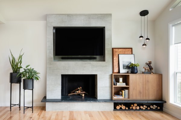 House in Bothell - Living Area Renovation - On this project was renovated living area. New hardwood, new fireplace with granite heart, custom cabinets, new light pendants, interior painting.