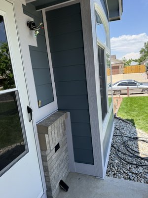 Brighton Colorado Home - Here we have a exterior remodel which included removing old siding and replacing it with new one then we probably the entire house with caulking, covering windows prior to painting and giving it its final look.￼