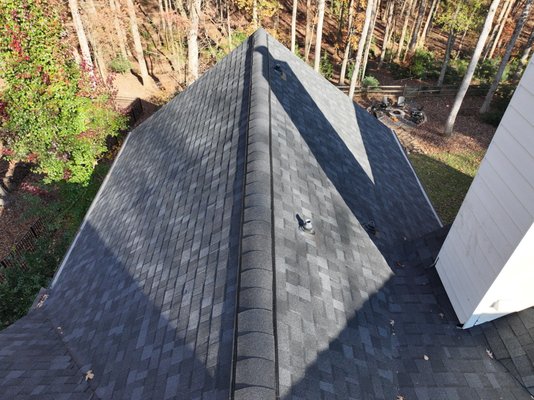 Roof Replacement - The customer in Suwanee was experiencing multiple leaks and an incorrectly built chimney. Roof replacement was able to be conducted within 30 days of the first call. The beautiful new shingles were the Owens Corning Onyx black. Beautiful!
