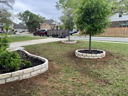Redo Garden beds and place new plants - The client asked us to redo their front yard Landscaping and we suggested to start by creating a border around their garden and trees. We designed the project, took care of materials & all labor. This material is a natural 4’’ limestone. We used drought tolerant and low maintenance plants which they requested. Redo Garden beds and place new plants - The client asked us to redo their front yard Landscaping and we suggested to start by creating a border around their garden and trees. We designed the project, took care of materials & all labor. This material is a natural 4’’ limestone. We used drought tolerant and low maintenance plants which they requested.