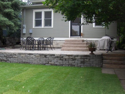 Patio and Retaining Wall installation - We installed a custom designed retaining wall, patio, stoop, and step units.
