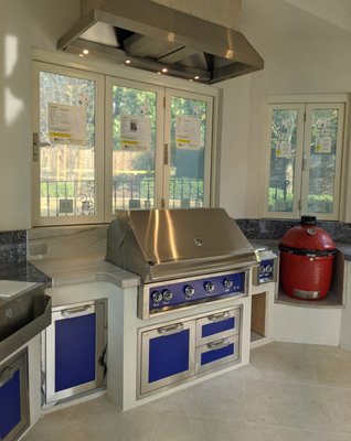 Custom Outdoor Kitchen Builds - My clients wanted a space to support their family gatherings, and they wanted it to function year-round. We installed the infrastructure, foundation, steel framing, conventional framing, a roof system that matched the main house, doors & windows, stucco system, plaster interiors, porcelain floor tiles, Hestan cabinets, granite countertops, fireplace and a custom exhaust system. Custom Outdoor Kitchen Builds - My clients wanted a space to support their family gatherings, and they wanted it to function year-round. We installed the infrastructure, foundation, steel framing, conventional framing, a roof system that matched the main house, doors & windows, stucco system, plaster interiors, porcelain floor tiles, Hestan cabinets, granite countertops, fireplace and a custom exhaust system.