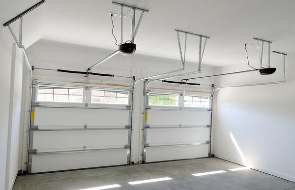 local Garage Opener Installation | Plano, TX - **March 2021: Garage Opener Installation in Plano, TX**

Timarron Garage Door Services completed a professional garage opener installation for a residential client in Plano, Texas. Our certified technicians installed a high-quality belt-drive garage door opener system, ensuring smooth and quiet operation for the homeowner's two-car garage.

The installation process included:
- Removal of the existing outdated opener unit
- Professional mounting of the new opener motor and rail system
- Installation of safety sensors and remote controls
- Complete system testing and calibration
- Customer training on proper operation and maintenance

The project was completed efficiently in one day, providing the client with reliable automated garage door operation and enhanced home security features. Our team ensured all safety protocols were followed and the installation met manufacturer specifications for optimal performance.