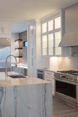 Dunedin Waterfront - A complete, ground-up luxury renovation on Dunedin's waterfront, with every finish personally selected by Local Interior Designs. Wide-plank tile, custom cabinetry, backlit mirrors, and a showstopping wet bar with quartzite counters and sculptural lighting come together for a home that feels curated down to the last detail. From concept to completion, this project reflects what full-service design really means.