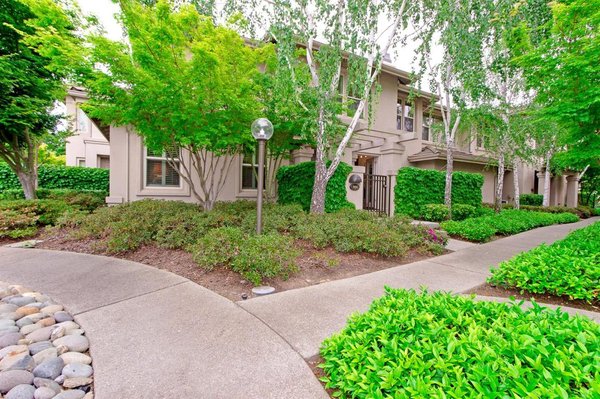 Gold River under contract within 7 days - Luxury living awaits! Don't miss one of the largest floor plans in the exclusive community of Stanford Court. A highly sought after corner unit right in the heart of Gold River. Nestled near trails, shopping and the river, this one has it all! From floor to ceiling this home is spotless with plenty of extras like custom lighting, surround sound and gorgeous plantation shutters. Downstairs offers an open concept, stunning polished concrete floors and a beautifully upgraded kitchen featuring stainless steel appliances and granite counter tops. A lovely den area is brightened by French doors opening up to a private courtyard. Upstairs boasts exquisite wood floors, a loft area, a generous bedroom and a huge master suite. Including double sinks, a large shower and walk-in closet, the master bathroom is sure to please! All of this and a large attached two car garage. Don't miss the luscious grounds and private pool. This is a fantastic opportunity to live in a great community!