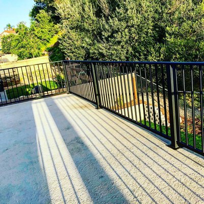 Sunset viewing - Simple yet bold black iron balcony guardrail: timeless design adds a touch of sophistication and security to your outdoor space.