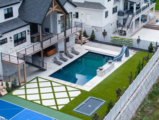 American Fork Custom Pool & Spa - Aqua360 Pools transformed this American Fork backyard into a complete outdoor retreat with a custom swimming pool, integrated spa, slide, water features and surrounding outdoor living space. The project was designed around the home and property to create a backyard that's beautiful, functional and built for entertaining.

Aqua360 Pools specializes in custom fiberglass and vinyl liner pools throughout Utah County and surrounding areas. We can incorporate spas, tanning ledges, automatic safety covers, LED lighting, slides, waterfalls and other custom features to create a pool designed around your family and backyard.