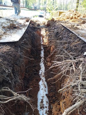 Sewer Line Roswell - This sewer line was run through the roots of historic trees.  Because of this, it needed to be done under the supervision of the cities historical counsel and a certified arborist.  3 Plumbing companties had turned this job down because they didn't want to deal with the "hassle" of adhering to the rules for historic trees.  We gladly took it on and were happy to be able to install a sewer connection that the customer had been trying to take care of for many years.  Because of these efforts, the trees will remain for many years to come and a failed septic tank was successfully removed.  Let us know how we can help with your difficult project and give us the chance to make it easier than you think.