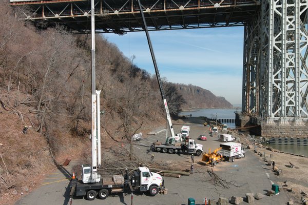 Storm Clean up at the George W Bridge - Tree Pruning and Tree Removal at the Palisades interstate Park near the George W Bridge, Bucket Trucks, Spider Lift and 2 Cranes were used in this project in order to cleanup several fallen, leaning and damage trees.