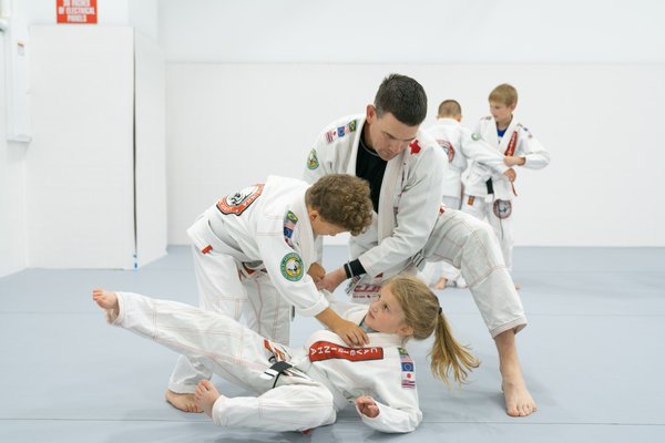 Jiu-Jitsu Self Defense Program - Here are a few photos of what you can expect from our Kids and Adults Jiu-Jitsu Self Defense program where we focus on self defense, sport Jiu-Jitsu, fitness, and building confidence on and off the mats.