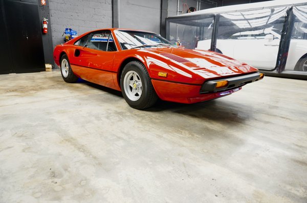 1977 Ferrari 308 GTB - We brought down this Ferrari 308 GTB from Rhode Island for our customer. In the process he decided he could leave it with us to go a once over the entire car. We completed various service items like belt service, water pump, engine reseal, clutch replacement and full brake system refurbishment.
Once all the mechanical work was completed we then completed paint correction and sealer to bring the natural beauty out through its Corso Rossa paint. 1977 Ferrari 308 GTB - We brought down this Ferrari 308 GTB from Rhode Island for our customer. In the process he decided he could leave it with us to go a once over the entire car. We completed various service items like belt service, water pump, engine reseal, clutch replacement and full brake system refurbishment.
Once all the mechanical work was completed we then completed paint correction and sealer to bring the natural beauty out through its Corso Rossa paint.