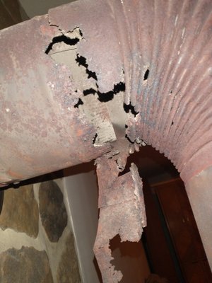 Dangerous exhaust caught in time - This was a dangerous condition.  The exhaust pipe of this heating system was allowing carbon monoxide, smoke and fumes into the room.  Without the inspection finding this condition, the owners may not have woken up in the morning if it burned all night.  Call us now to inspect your system and provide a report of any conditions that may harm your family.