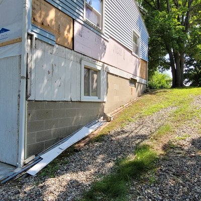 Lake cottage renovation - This remodel involves the addition of a 25x13 rear porch, 5 new windows, 3 doors, reframing and repair of exterior walls, roof replacement on the cottage and new roof on the porch, and residing the cottage. Lake cottage renovation - This remodel involves the addition of a 25x13 rear porch, 5 new windows, 3 doors, reframing and repair of exterior walls, roof replacement on the cottage and new roof on the porch, and residing the cottage.