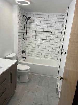 Mike's Bathroom - This bathroom was a full gut all the way to the studs. Upgraded everything behind the walls. Pick larger tile for the floor & large subway tile for the shower. The black grout & fixtures really tie everything together. Mike's Bathroom - This bathroom was a full gut all the way to the studs. Upgraded everything behind the walls. Pick larger tile for the floor & large subway tile for the shower. The black grout & fixtures really tie everything together.