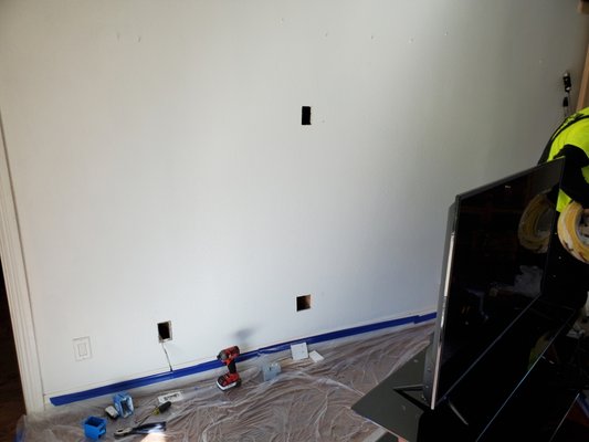 Television Power. Mount and plugs... - Homeowner requested television mounted on wall with new plugs behind the entertainment center and new plugs behind the television, concealed from sight.