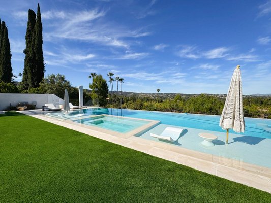 Complete Home & Pool Remodel - Encino, CA 91316 - At this project in Encino, CA 91316, we undertook a comprehensive home and pool renovation project that fully transformed the property into a modern, luxurious living space. This project involved a complete redesign and remodel of both the interior and exterior, incorporating high-end materials, innovative designs, and meticulous craftsmanship to create a space that perfectly balances functionality with aesthetic appeal.

Interior Remodeling
The interior renovation encompassed every aspect of the home, from flooring to ceilings, to deliver a modern and cohesive look. We began by updating the layout to improve the flow of the space, making it more open and inviting. The floors were upgraded with elegant hardwood throughout the living areas, giving the home a warm yet sophisticated atmosphere. In the kitchen, we installed custom cabinetry, high-end countertops, and state-of-the-art appliances to create a chef’s dream kitchen. The bathrooms were also fully remodeled with modern fixtures, luxurious vanities, and contemporary tile work that brings a spa-like feel to the space.

Lighting was another key element of the remodel, with recessed lighting installed throughout the home to create a bright and airy environment. We also added designer light fixtures to key areas like the dining room and entryway, giving the home a touch of elegance and style. The entire home was repainted with a neutral color palette to enhance the sense of space and provide a clean backdrop for the homeowner’s personal touches.

Exterior Renovation & Pool Remodel
In addition to the interior upgrades, the exterior of the home received a complete overhaul to elevate the curb appeal and outdoor living experience. We replaced the old siding with new, energy-efficient materials and gave the house a fresh, modern look with a new coat of paint. The landscaping was redesigned to complement the home's new aesthetic, with drought-tolerant plants, new walkways, and updated outdoor lighting to create a welcoming environment.

The pool area was one of the most significant aspects of this remodel. We transformed an outdated pool into a modern oasis by resurfacing the pool with beautiful new tiles and adding custom water features for a luxurious touch. The surrounding pool deck was also updated with sleek pavers and new lounge areas, creating the perfect space for relaxing and entertaining. The outdoor living space was further enhanced with the addition of a custom-built pergola and a fully equipped outdoor kitchen, making this home ideal for hosting guests or enjoying time with family.

Upgrades and Special Features
Throughout the project, we focused on adding features that would enhance both the functionality and comfort of the home. Smart home technology was installed, allowing the homeowners to control lighting, security, and temperature through their smartphones. We also added energy-efficient windows and doors, as well as upgraded the insulation to improve the home’s energy performance and reduce utility costs.

The entire project was designed with the homeowner’s vision in mind, ensuring that every detail was tailored to their needs and preferences. The result is a stunning, modern home that combines luxury and practicality in every space.

This full home and pool remodel at Encino, CA 91316, is a testament to our commitment to quality craftsmanship and customer satisfaction. From the indoor living spaces to the outdoor entertainment areas, every aspect of this renovation was carefully planned and executed to create a home that is not only beautiful but also functional for everyday living. We take pride in the work we did on this project and are thrilled to have delivered a finished product that exceeds the homeowner's expectations.

Whether you’re looking to renovate your kitchen, update your bathroom, or transform your outdoor space, our team has the experience and expertise to bring your vision to life. Contact us today to discuss your next home remodeling project!
