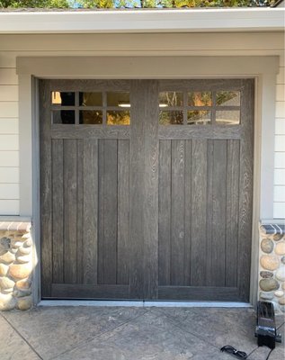 Faux wood never looked so good - This quiet home needed an upgrade to their garage doors. The Clopay Canyon Ridge Limited edition is a beautiful faux wood door, built with truly revolutionary materials that provide a warmth, feel, and three dimensional appearance, but with low maintenance modern materials.