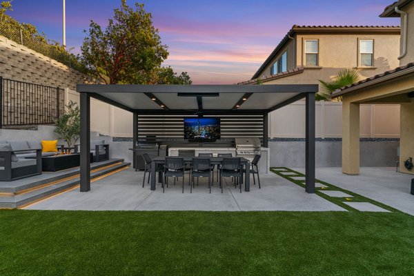 Cooper Greens Way Project - For this stunning backyard remodel, we completely demolished the existing space to make way for a fully custom outdoor retreat. The project features premium artificial turf for a lush, low-maintenance lawn, a new concrete patio for a clean and functional foundation, and a custom-built patio cover that provides shade and year-round usability. We created an elevated fire pit area finished with stylish tile flooring, ideal for cozy evening gatherings. A fully custom-designed and built BBQ island serves as the centerpiece for outdoor entertaining, while strategically placed landscape lighting highlights the space’s best features and enhances the ambiance at night. Every detail was thoughtfully crafted to deliver a beautiful, functional, and enduring outdoor living experience.