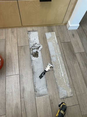 Tile Repair - Removed and reset loose tile in kitchen Tile Repair - Removed and reset loose tile in kitchen