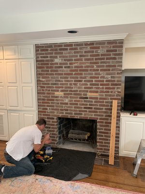 Fireplace reface - Customer bought a home with a dated fireplace and wanted a face lift. We ran new electric and reinforcement for TV hanging and finished to compliment existing cabinetry.