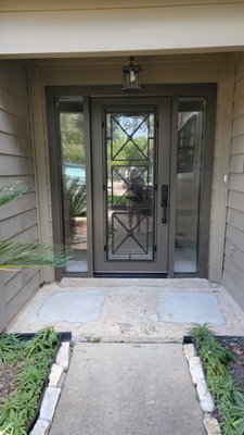 Cambridge Doors – Classic & Modern Entryway Showcase - At Cambridge Doors & Windows, we take pride in transforming entryways into stunning focal points that elevate curb appeal and reflect each homeowner’s style. Here are two standout projects that showcase our craftsmanship and design versatility:
🔹 Classic Wood Entry with Decorative Glass
This timeless front door features rich wood construction and a beautifully detailed glass insert that balances privacy with natural light. The glass design combines clear and frosted elements in an elegant pattern, creating visual interest while maintaining discretion. Framed by two vertical sidelights with crisp white shutters and set against a red brick base, this entryway blends warmth and sophistication. It’s the perfect choice for homeowners seeking a traditional look with a custom touch.
🔹 Modern Door with Ribbed Glass Sidelights
For a sleek, contemporary aesthetic, we installed a dark-framed door with integrated glass panels and ribbed sidelights that offer texture and privacy. A lantern-style light fixture above the door adds charm and functionality, while the neutral-toned siding and landscaped stone pathway complete the modern vibe. The reflective glass subtly connects the indoor and outdoor spaces, making this entrance feel open, stylish, and inviting.
Every door we install is tailored to the home’s architecture and the client’s vision. From material selection to final fit and finish, our team ensures quality, durability, and beauty in every detail. Whether you're looking for classic elegance or modern flair, Cambridge Doors & Windows delivers entryways that make a lasting impression. Cambridge Doors – Classic & Modern Entryway Showcase - At Cambridge Doors & Windows, we take pride in transforming entryways into stunning focal points that elevate curb appeal and reflect each homeowner’s style. Here are two standout projects that showcase our craftsmanship and design versatility:
🔹 Classic Wood Entry with Decorative Glass
This timeless front door features rich wood construction and a beautifully detailed glass insert that balances privacy with natural light. The glass design combines clear and frosted elements in an elegant pattern, creating visual interest while maintaining discretion. Framed by two vertical sidelights with crisp white shutters and set against a red brick base, this entryway blends warmth and sophistication. It’s the perfect choice for homeowners seeking a traditional look with a custom touch.
🔹 Modern Door with Ribbed Glass Sidelights
For a sleek, contemporary aesthetic, we installed a dark-framed door with integrated glass panels and ribbed sidelights that offer texture and privacy. A lantern-style light fixture above the door adds charm and functionality, while the neutral-toned siding and landscaped stone pathway complete the modern vibe. The reflective glass subtly connects the indoor and outdoor spaces, making this entrance feel open, stylish, and inviting.
Every door we install is tailored to the home’s architecture and the client’s vision. From material selection to final fit and finish, our team ensures quality, durability, and beauty in every detail. Whether you're looking for classic elegance or modern flair, Cambridge Doors & Windows delivers entryways that make a lasting impression.