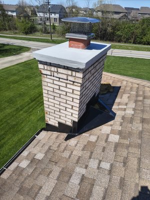 Chimney Crown Replacement, Custom Chimney Cricket & Soldered Flashings - This project included a full chimney crown replacement, custom chimney cricket installation, and new custom soldered flashings. We removed the old damaged crown and deteriorated material, rebuilt the top with new reinforcement and concrete, and sealed it for long-term protection.

We also built a custom chimney cricket to help divert water away from the chimney and installed new black soldered flashings/counter-flashings around the base for a clean, watertight finish. The job was completed with full cleanup and a professional final appearance.