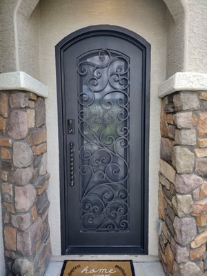 Single Exterior Iron Doors - Pre-hung Single Iron Door made from high quality 12 gauge and solid steel scroll work. All doors are fully foam insulated including the frame and have a welded threshold built in. This door comes with a standard deadbolt, pull handles and magnetic bug screens. The operable glass allows you to keep the door closed and open the glass panel independently. Let that nice breeze in the house while keeping the bugs out. All doors have low-e, dual pane, tempered glass to increase the amount of insulation. Our doors are complete with all seals, weather stripping and are finished with a strong enamel based paint that will not rust or fade overtime.

HOW OUR PRODUCTS ARE MEASURED

Our sizes are measured from outside of jamb to outside of jamb. For example, a 72” x 96” door listed on our website means that 72” is the width from outside to outside of jamb (not the actual width size of the door) and 96” is the height from outside of jamb to bottom of the threshold (not the actual height of the door).

We recommend the rough opening be 1” wider and 1” taller than the door size ordered to give the installer enough room to comfortably position the jamb into place and make sure it is leveled.

JAMB/FRAME/THRESHOLD

The Jamb/Frame is included with every door and prehung.  The jamb is constructed with 12 gauge tube (above industry standard) and Polyurethane Foam Core is filled in the jamb and doors for greater insulation. A steel threshold is included and comes welded on the jamb.

HINGES

Steel Bullet hinges with grease fittings and copper crush washer come welded on the jamb and door. Each heavy duty hinge can hold up to 1000lbs which allows customers to comfortably open and close the doors.

WEATHER STRIPPING

Dual foam weather stripping is included and comes installed around the door frame as well as a bottom rubber door sweep.  Designs with operable glass will have dual sealing around the glass.  The purpose is to help reduce air infiltration and water penetration.  The dual sealing around the glass allows for weather stripping on both sides of the glass.