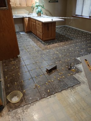 Kitchen Floor Remodeling - I removed the old carpet and pad. Measured Sq. Ft. Bought Supplies needed for project.
Leveled the floor, using self leveling underlayment. Waited 24 hrs drying time. And then began laying down new ceramic tile, with Mortar. With leveler clips and spacers.
Shouldn't take too long. Happy Customer already. Kitchen Floor Remodeling - I removed the old carpet and pad. Measured Sq. Ft. Bought Supplies needed for project.
Leveled the floor, using self leveling underlayment. Waited 24 hrs drying time. And then began laying down new ceramic tile, with Mortar. With leveler clips and spacers.
Shouldn't take too long. Happy Customer already.