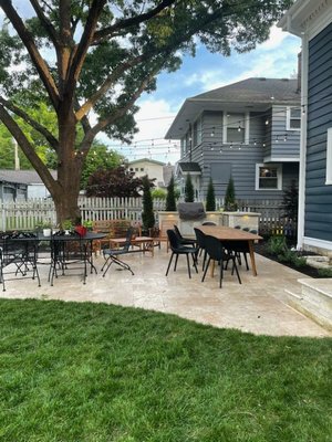 Backyard outdoor living space - We Installed a travertine patio in this back yard with a custom grill island. The island has a limestone face, custom limestone counters, na