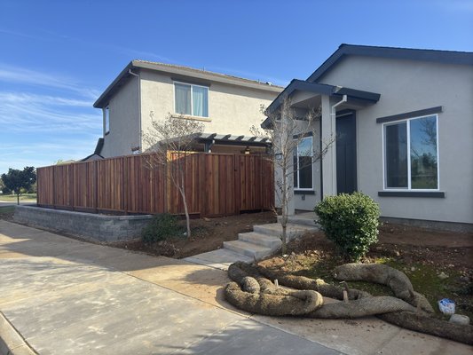 Board on Board 7' Tall Picture Frame Fence with Hidden Metal Posts Stained - This project features a 7’ tall board-on-board picture frame fence built with hidden metal posts for maximum strength and a clean, seamless look. We used premium redwood boards, installed tight picture-frame trim, and ensured every line stayed straight and level along the property. The entire fence was stained to enhance the grain and extend the life of the wood. The result is a modern, durable, and high-privacy fence that adds curb appeal and long-term value to the home. Board on Board 7' Tall Picture Frame Fence with Hidden Metal Posts Stained - This project features a 7’ tall board-on-board picture frame fence built with hidden metal posts for maximum strength and a clean, seamless look. We used premium redwood boards, installed tight picture-frame trim, and ensured every line stayed straight and level along the property. The entire fence was stained to enhance the grain and extend the life of the wood. The result is a modern, durable, and high-privacy fence that adds curb appeal and long-term value to the home.