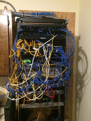 Network Overhaul - This network was in a bad shape.  Constant IT issues and nobody would take ownership or be able to find a resolution to their network issues.

TCS was able to come in over a weekend and rewire the network into a central location that was more accessible, upgrade old outdated hardware, and label everything.

The client is happy, the area is serviceable and we can manage the customer on-going with any IT-related issues quickly and efficiently. 

Don't wait for a disaster like this to happen to you.  Work with a professional team to manage your IT needs now and in the future.