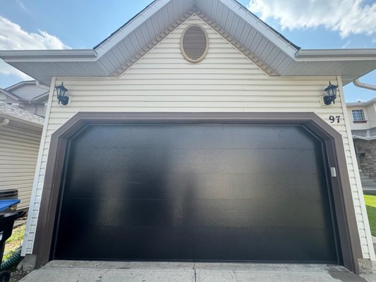 New Garage Door Installation - Transforming garages in Calgary! Our client wanted a modern upgrade for their garage door's look and system. We delivered with a sleek new design and the best garage door system for reliability and style. Call us today for top-notch garage door upgrades and services!