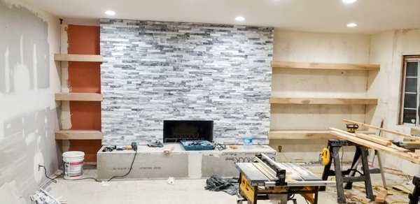 Fireplace remodel and floating shelves - First picture is the mantle area, we boxed up and framed out the fireplace. then built the custom floating shelves. They're made from 2x4s wrapped in a thin sanded plywood with mitered corners so the grains all flow together.
Second picture is more floating shelves as well as a make-up station we made in one of the other closets. Fireplace remodel and floating shelves - First picture is the mantle area, we boxed up and framed out the fireplace. then built the custom floating shelves. They're made from 2x4s wrapped in a thin sanded plywood with mitered corners so the grains all flow together.
Second picture is more floating shelves as well as a make-up station we made in one of the other closets.