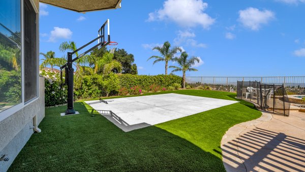 Basketball Court & Artificial Turf- Porter Ranch - From an uninviting patch of dead grass into a family-friendly haven, complete with a basketball court and surrounding artificial turf. The backyard is now vibrant and fully usable! Basketball Court & Artificial Turf- Porter Ranch - From an uninviting patch of dead grass into a family-friendly haven, complete with a basketball court and surrounding artificial turf. The backyard is now vibrant and fully usable!