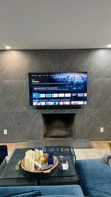 tile wall tv install - This 65” TV installation was completed over a tiled wall, requiring precision drilling and proper anchoring to ensure a secure and long-lasting mount. Before installation, we carefully mapped out the TV placement by taping off the exact dimensions on the wall, allowing the client to visualize height and positioning before any holes were made. Once approved, we installed the mount using the appropriate anchors for tile, ensuring a clean, level finish. The final result is a sleek, securely mounted TV that complements the space while maintaining a professional, polished look. tile wall tv install - This 65” TV installation was completed over a tiled wall, requiring precision drilling and proper anchoring to ensure a secure and long-lasting mount. Before installation, we carefully mapped out the TV placement by taping off the exact dimensions on the wall, allowing the client to visualize height and positioning before any holes were made. Once approved, we installed the mount using the appropriate anchors for tile, ensuring a clean, level finish. The final result is a sleek, securely mounted TV that complements the space while maintaining a professional, polished look.