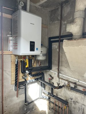 Navien Combi Tackless System Installation - We came for diagnosis and after the diagnosis the client decided to replace the unit.
We removed the old 50-year-old heater, which produced about 50% efficiency, and installed a new equipment that has 95% efficiency.
We removed the old heather and water heater and left the combi boiler, installed the Navien combi tankless system, which performs two functions in one: floor heating and water heating. Navien Combi Tackless System Installation - We came for diagnosis and after the diagnosis the client decided to replace the unit.
We removed the old 50-year-old heater, which produced about 50% efficiency, and installed a new equipment that has 95% efficiency.
We removed the old heather and water heater and left the combi boiler, installed the Navien combi tankless system, which performs two functions in one: floor heating and water heating.