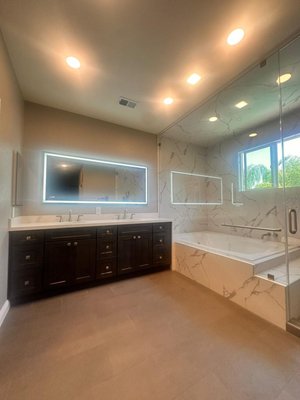 Antioch Two Bathroom Remodels and Steam Room - A sleek and stylish bathroom transformation featuring contemporary fixtures, a spacious glass-enclosed shower, and a minimalist vanity for a clean, sophisticated look