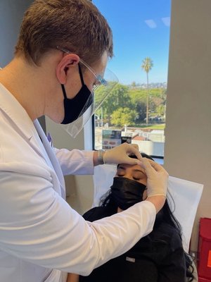 Michael Bontekoe PA-C - Michael Bontekoe is a nationally board-certified PA (Physician Assistant) and has been in practice since 2001.
Michael Bontekoe, MS, PA-C, joined The Roxbury Institute in 2016 and specialized in medical and cosmetic dermatology. He has been in practice since 2001 after spending 8 years at Central Michigan University. He completed his medical training at Cedars-Sinai Medical Center and various private practices throughout the Los Angeles area. Since then, he has been in private practice specializing in dermatology. In 2003, he began serving as the sole dermatology provider for AIDS Healthcare Foundation-Los Angeles, treating thousands of medically complex dermatology patients. He has a passion for clinical research and staying up-to-date on the newest treatments available. He has served on advisory boards and has worked with pharmaceutical companies to develop new medications in the dermatology field. He has appeared on television programs for the TLC network, is a contributor writer for dermatology articles, has taught university graduate students, and presented case studies at national dermatology conferences.
Michael Bontekoe currently sees a wide realm of dermatology patients in the clinic. He has special areas of interest, including acne, rosacea, acne scarring, pre-cancerous lesions, the use of cosmeceutical skincare products in dermatology, Botox injections, and using lasers for sun damaged and aging skin. He's an integral part of our incredible team and is not only an expert but is highly compassionate and works closely with our patients and the other doctors at The Roxbury Institute. Michael Bontekoe PA-C - Michael Bontekoe is a nationally board-certified PA (Physician Assistant) and has been in practice since 2001.
Michael Bontekoe, MS, PA-C, joined The Roxbury Institute in 2016 and specialized in medical and cosmetic dermatology. He has been in practice since 2001 after spending 8 years at Central Michigan University. He completed his medical training at Cedars-Sinai Medical Center and various private practices throughout the Los Angeles area. Since then, he has been in private practice specializing in dermatology. In 2003, he began serving as the sole dermatology provider for AIDS Healthcare Foundation-Los Angeles, treating thousands of medically complex dermatology patients. He has a passion for clinical research and staying up-to-date on the newest treatments available. He has served on advisory boards and has worked with pharmaceutical companies to develop new medications in the dermatology field. He has appeared on television programs for the TLC network, is a contributor writer for dermatology articles, has taught university graduate students, and presented case studies at national dermatology conferences.
Michael Bontekoe currently sees a wide realm of dermatology patients in the clinic. He has special areas of interest, including acne, rosacea, acne scarring, pre-cancerous lesions, the use of cosmeceutical skincare products in dermatology, Botox injections, and using lasers for sun damaged and aging skin. He's an integral part of our incredible team and is not only an expert but is highly compassionate and works closely with our patients and the other doctors at The Roxbury Institute.